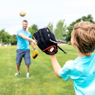 Playing catch on a beautiful lawn