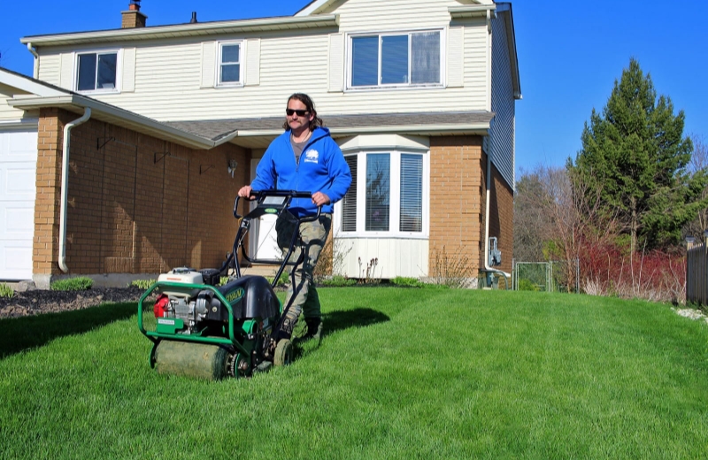 Optimism Aeration worker loving to aerate a lawn